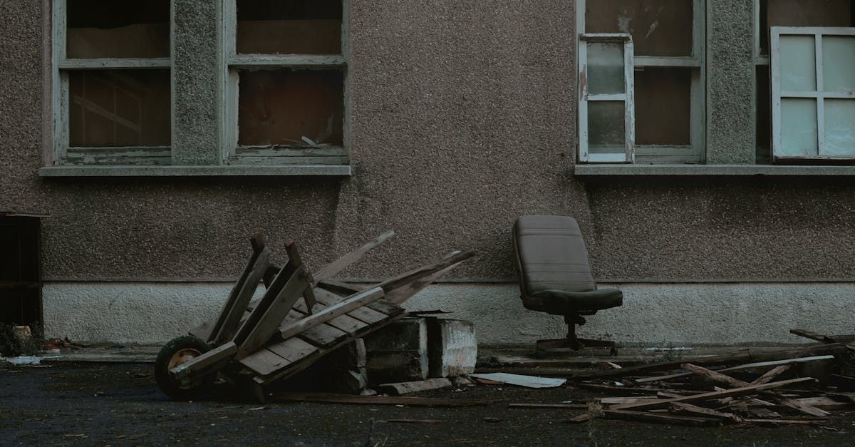 Garbage laying up against an apartment wall