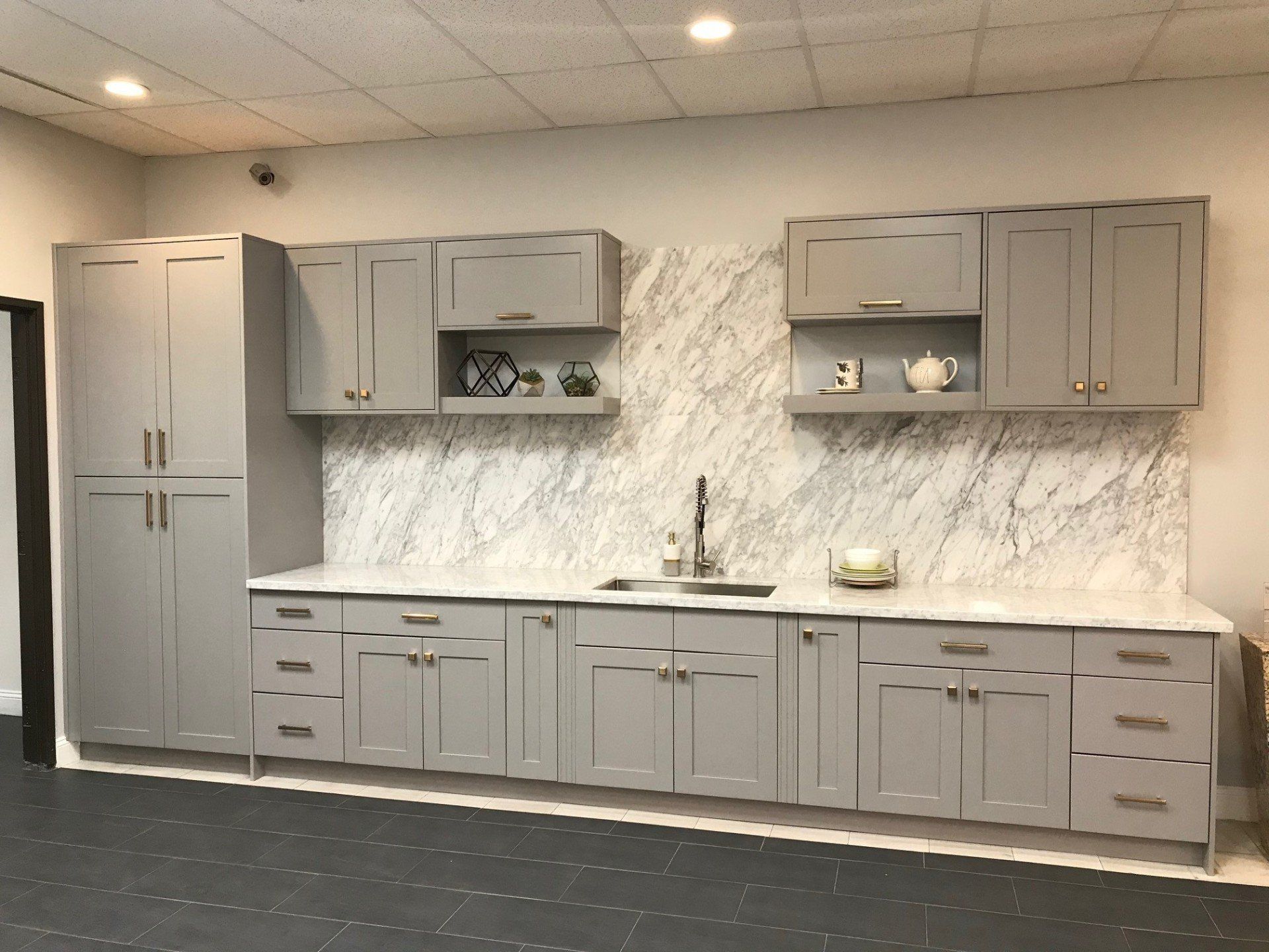 Kitchen Sink With Color Gray Cabinets And Marble Counter Tops — Riverside, CA — Vallin Bros Contractors