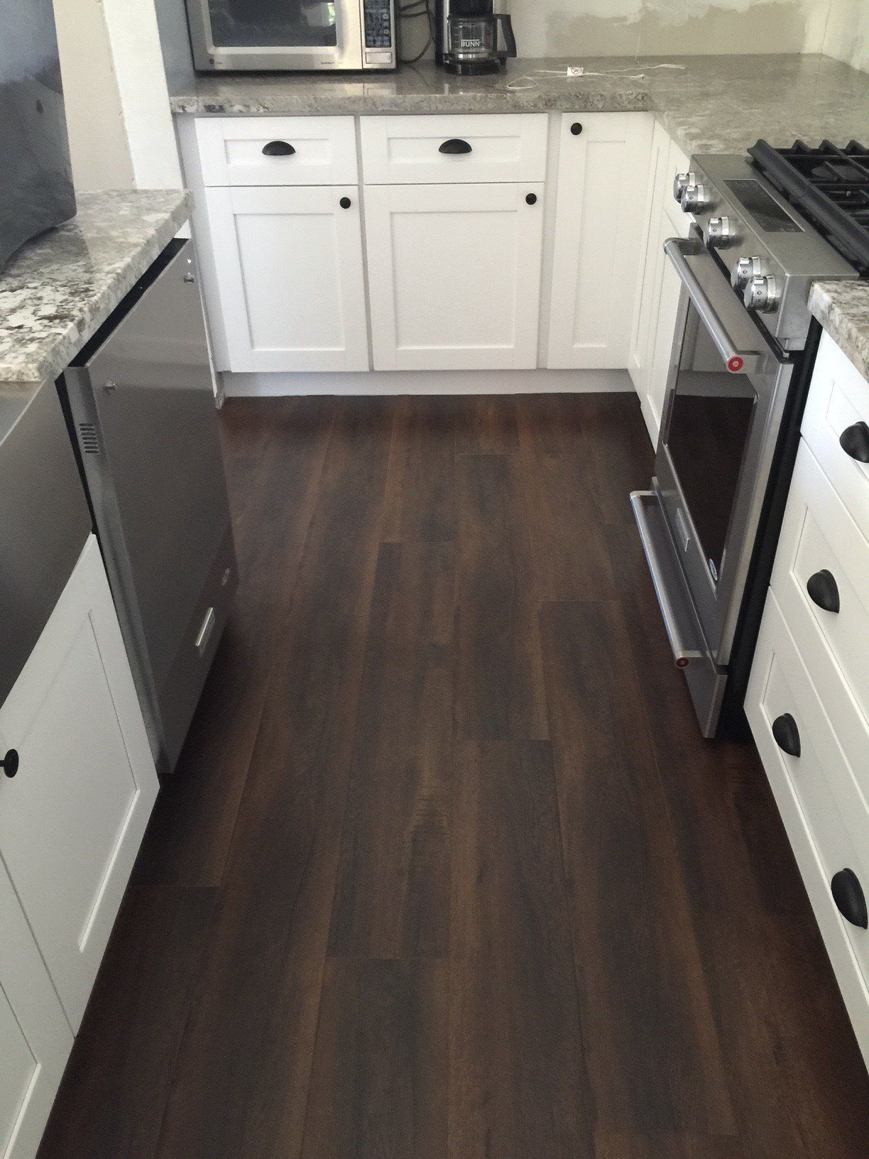 Dark Wooden Kitchen Floor — Riverside, CA — Vallin Bros Contractors