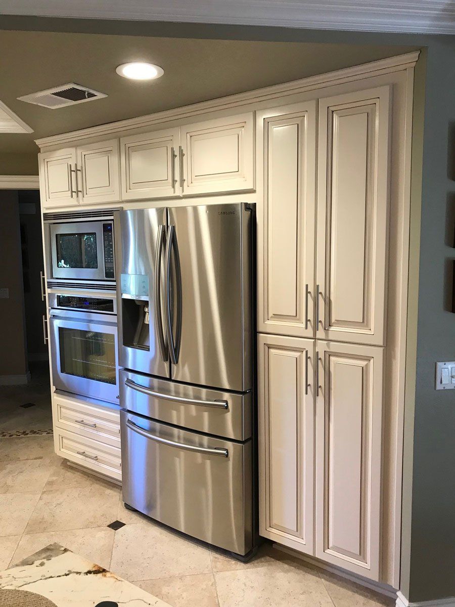 White Cabinets Beside Refrigerator — Riverside, CA — Vallin Bros Contractors