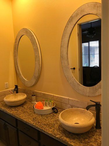 Bathroom with Circle Mirrors and Basins — Riverside, CA — Vallin Bros Contractor