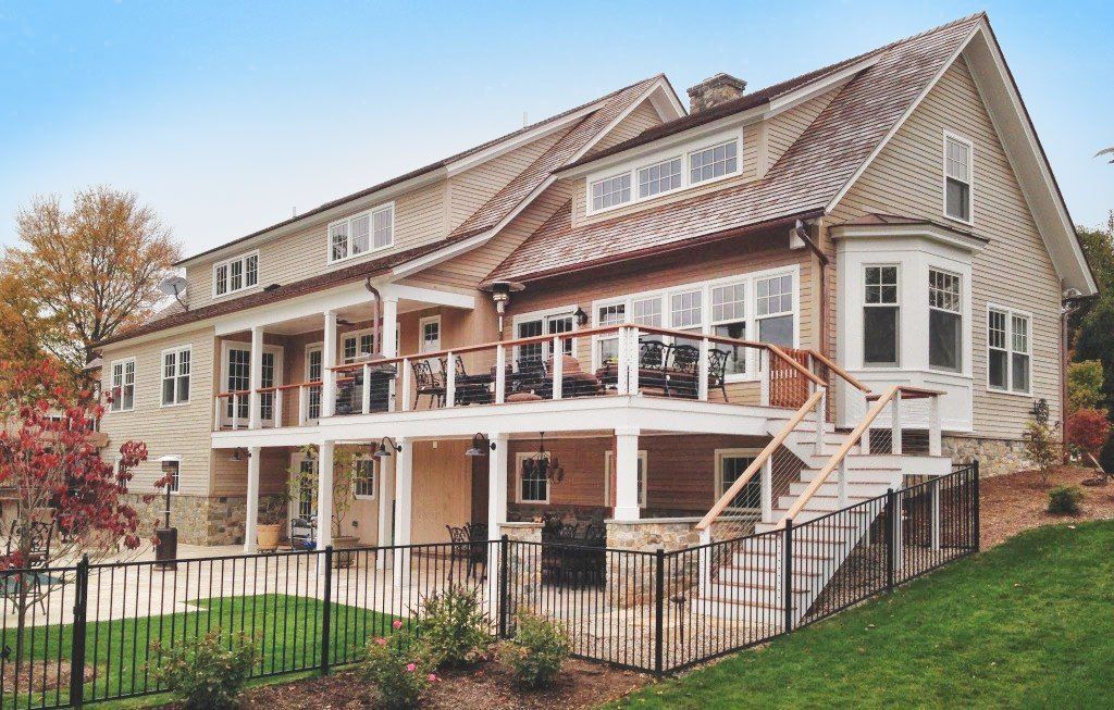 A large house with a large porch and stairs