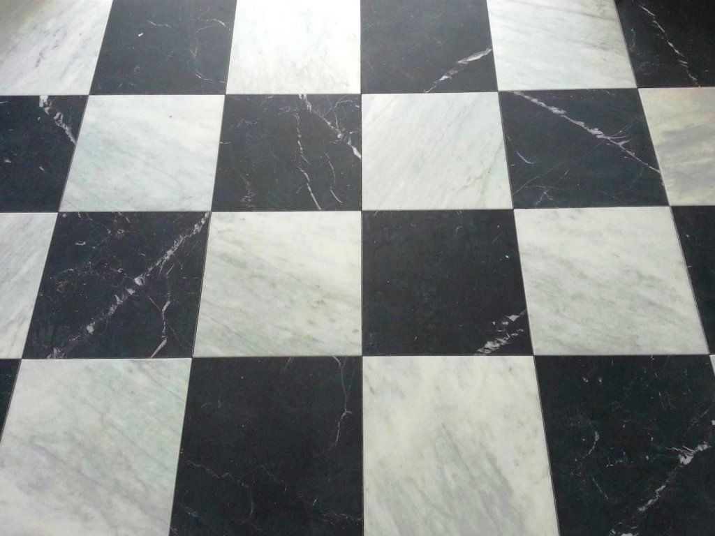 A black and white checkered floor that looks like a chess board
