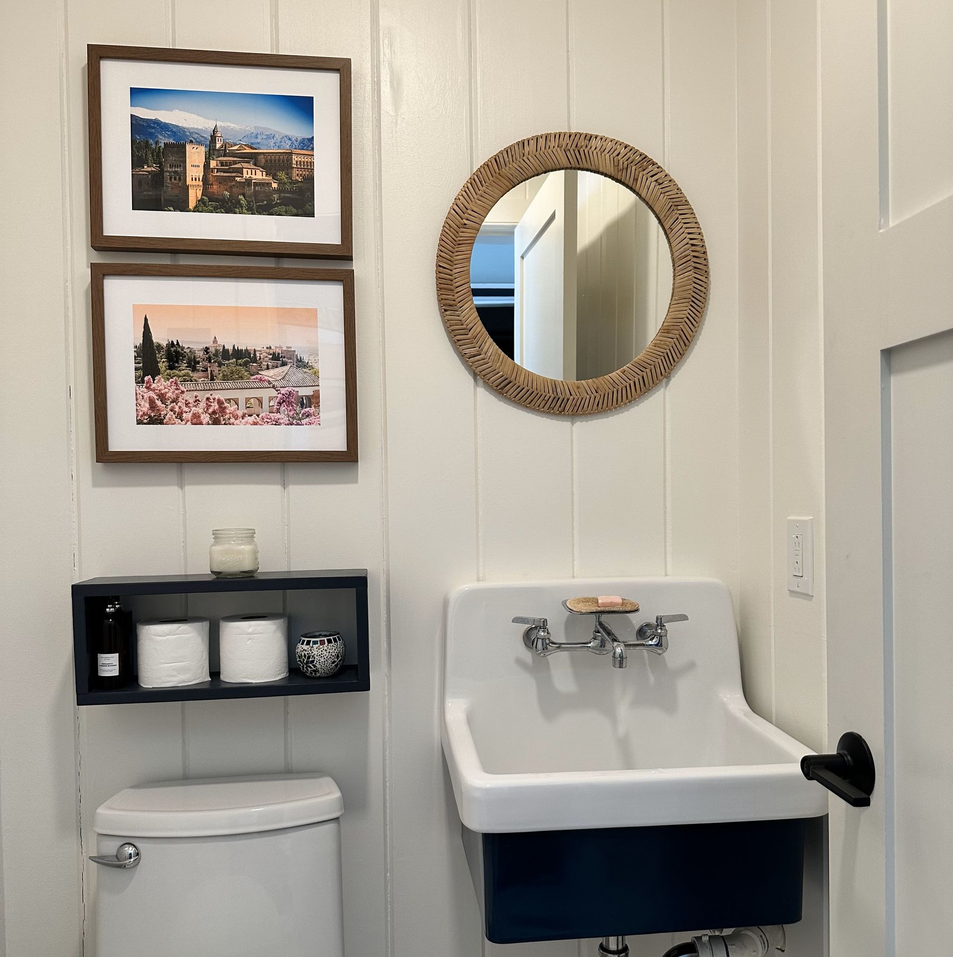 A bathroom with a toilet a sink and a mirror