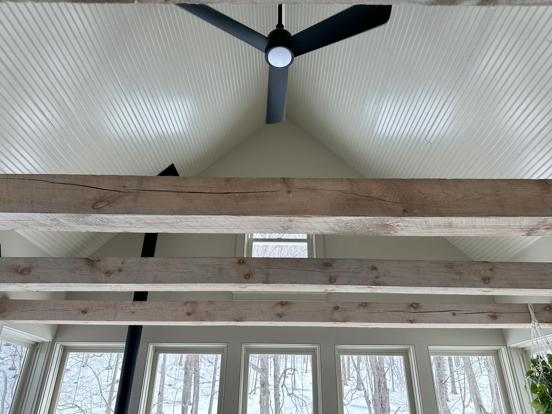 A ceiling fan is hanging from the ceiling of a house