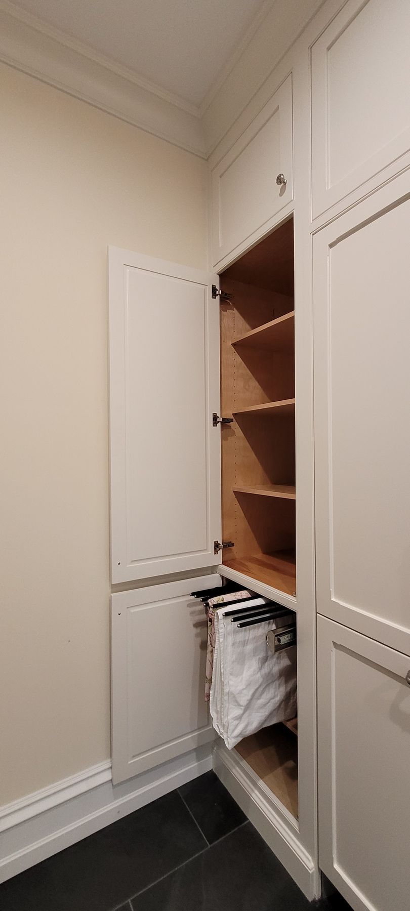 A laundry room with a washer and dryer built into the wall.