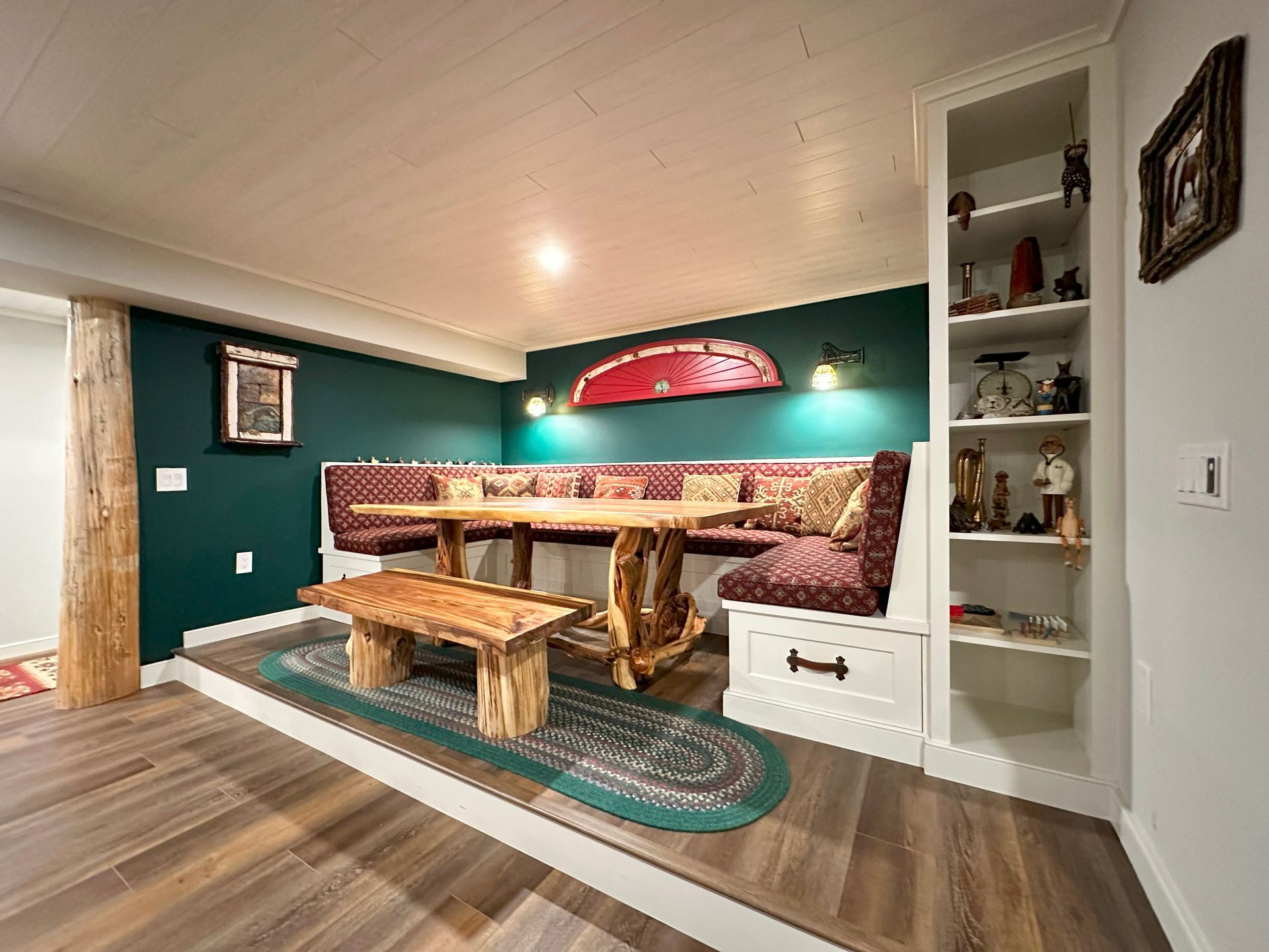 A dining room with a wooden table and benches.