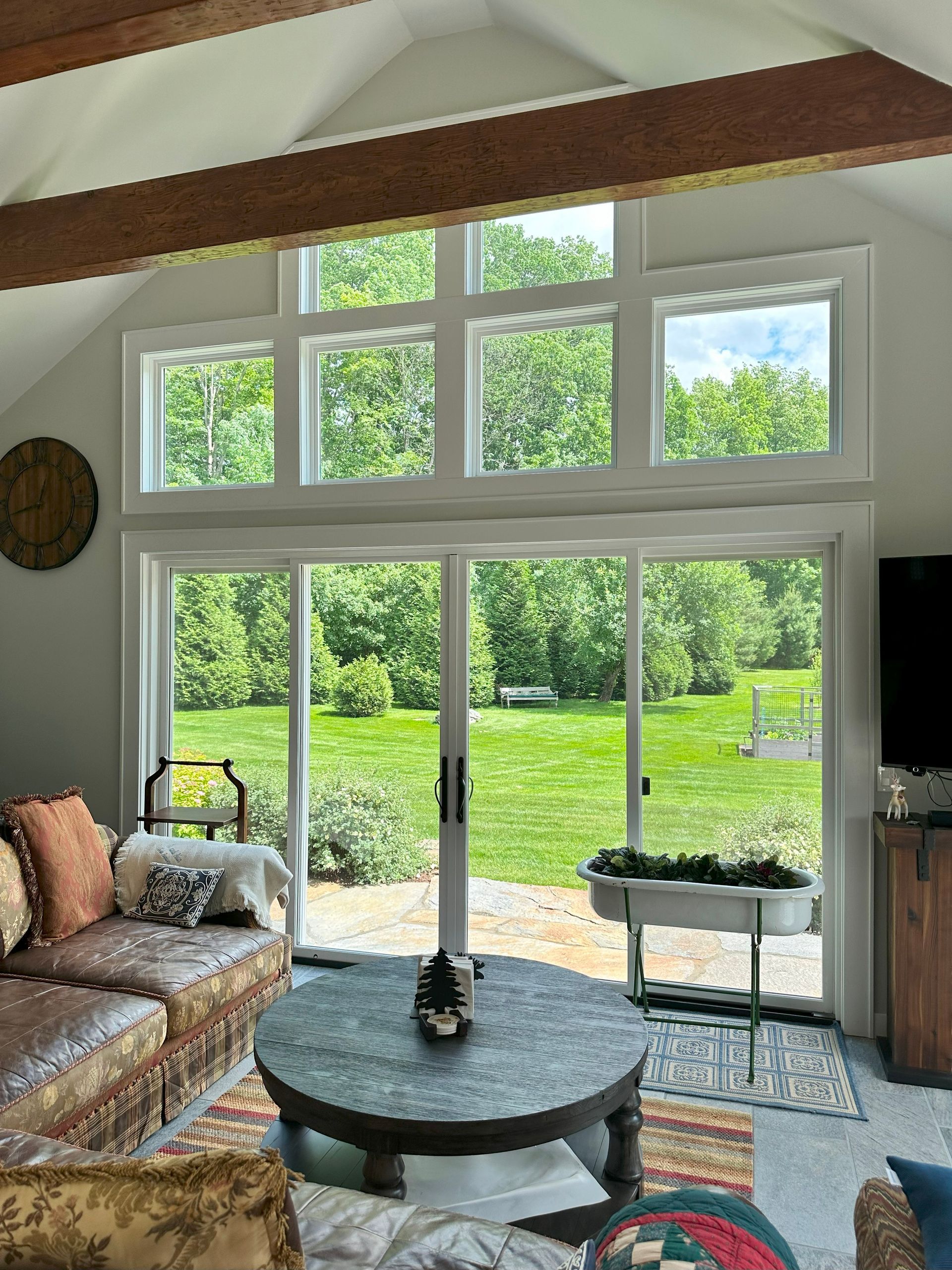 A living room with a couch and a round coffee table