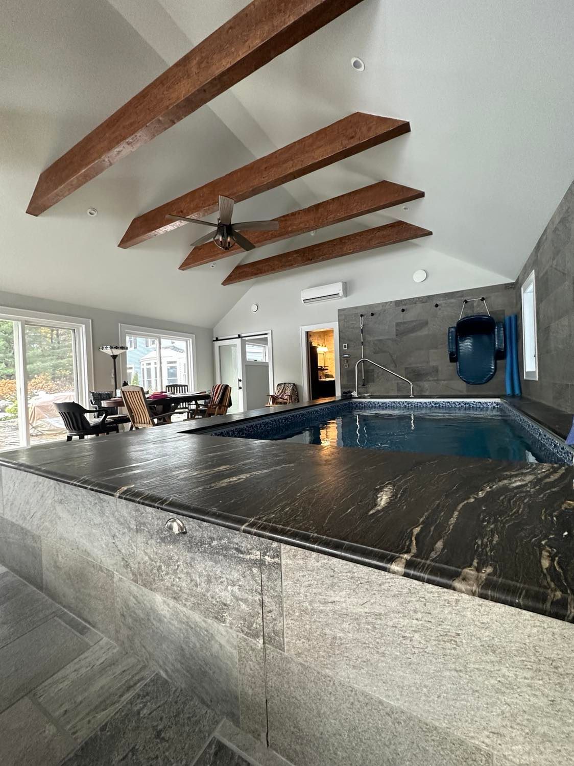 There is a large swimming pool in the middle of the room.