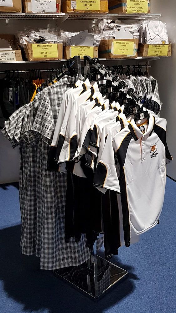 School Uniforms Hanging on a Rack — Workwise Clothing Forster in Forster, NSW
