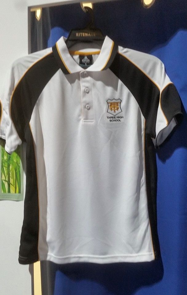 White Polo Shirt With Black and Gold Accents, School Logo — Workwise Clothing Forster in Forster, NSW
