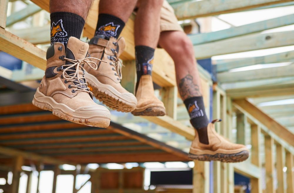 Two Workers Wearing Work Boots and Construction Socks — Workwise Clothing Forster in Forster, NSW