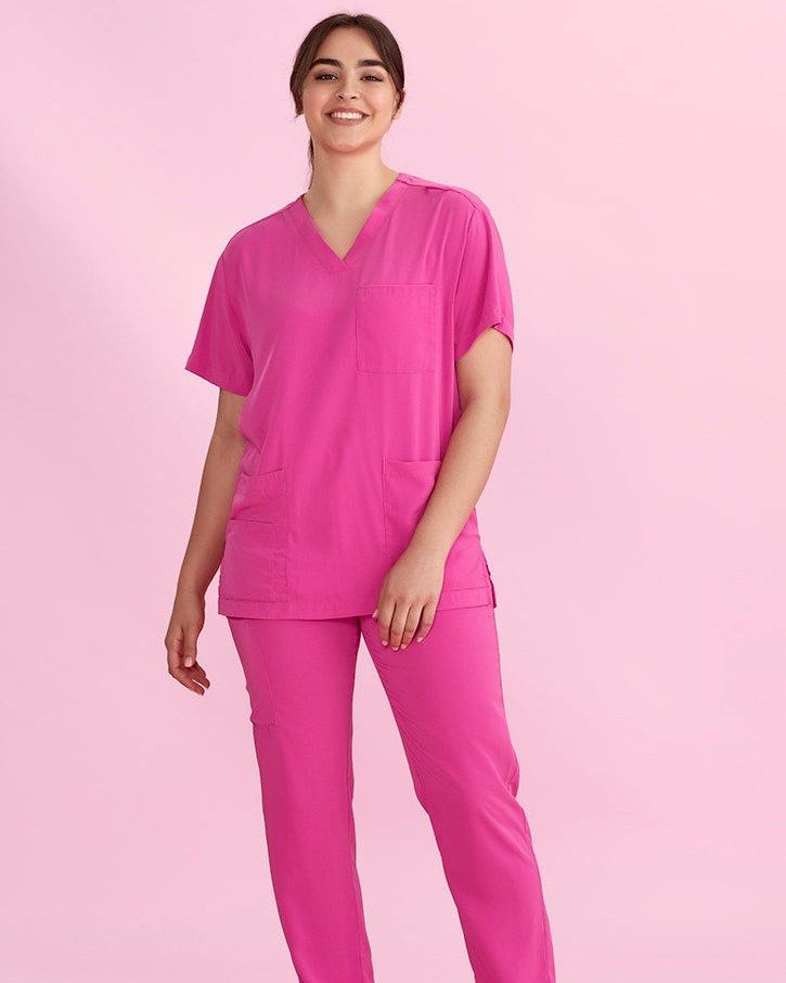 Woman Wearing Bright Pink Medical Scrubs — Workwise Clothing Forster in Forster, NSW