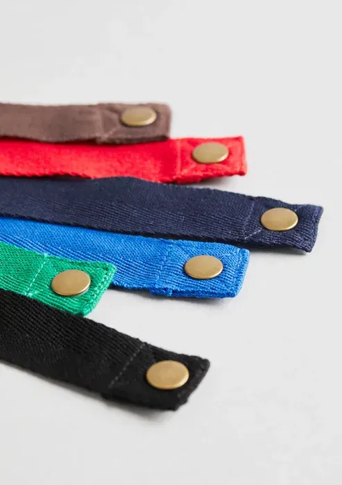 Close-up of Six Colorful Canvas Straps, Each With a Brass Snap — Workwise Clothing Forster in Forster, NSW