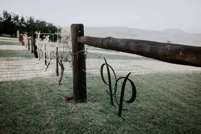 A wooden fence with the letter p on it