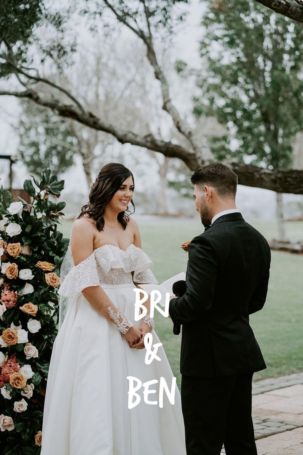 A bride and groom are holding hands during their wedding ceremony.
