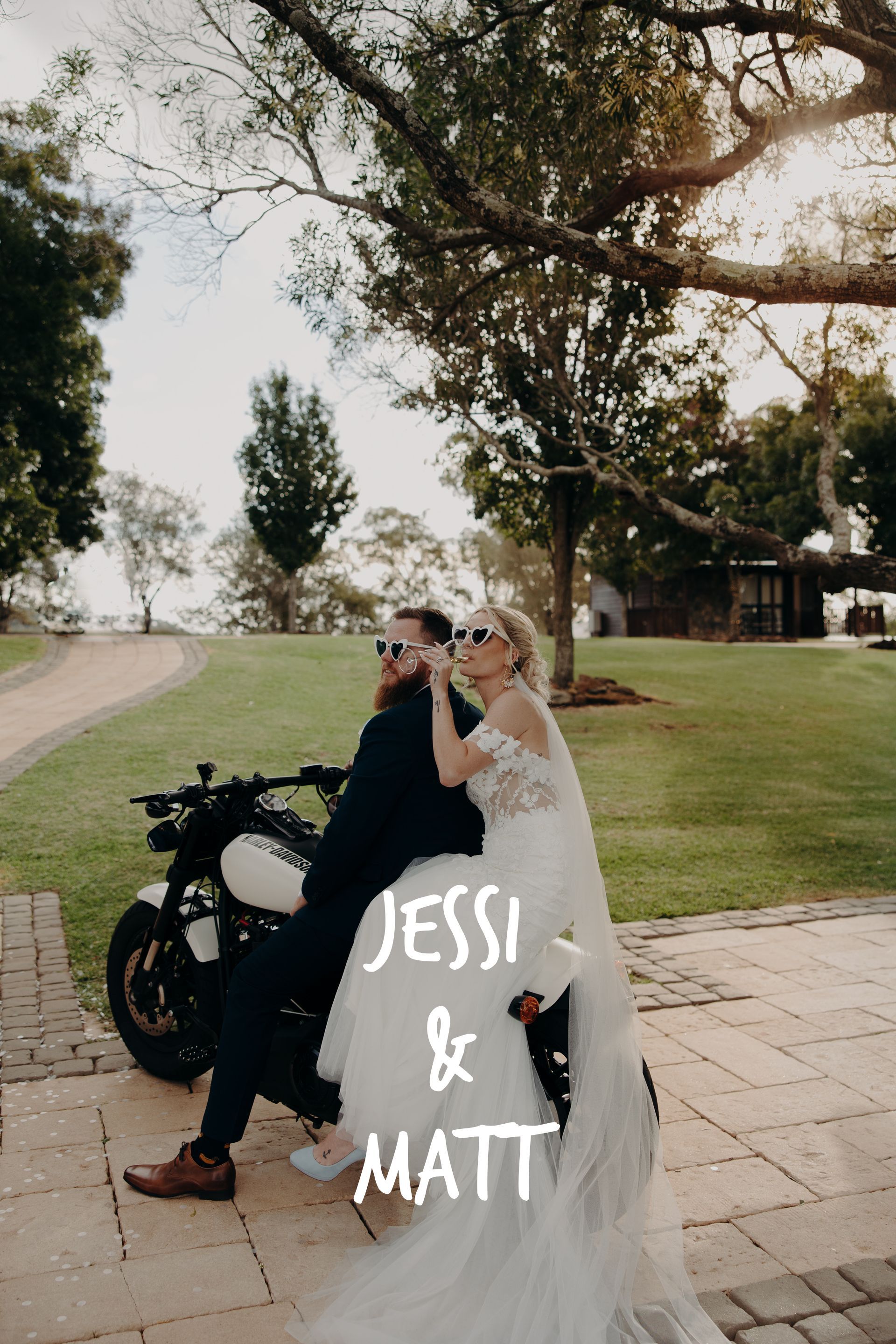A bride and groom are sitting on a motorcycle.