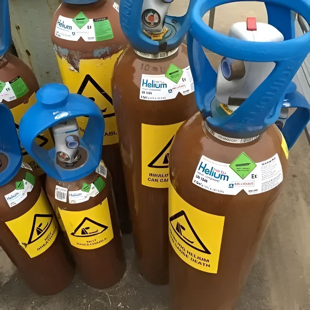 Several Cylinders of Helium Are Sitting on a Table — Northern Rivers Gas Distribution in Casino, NSW