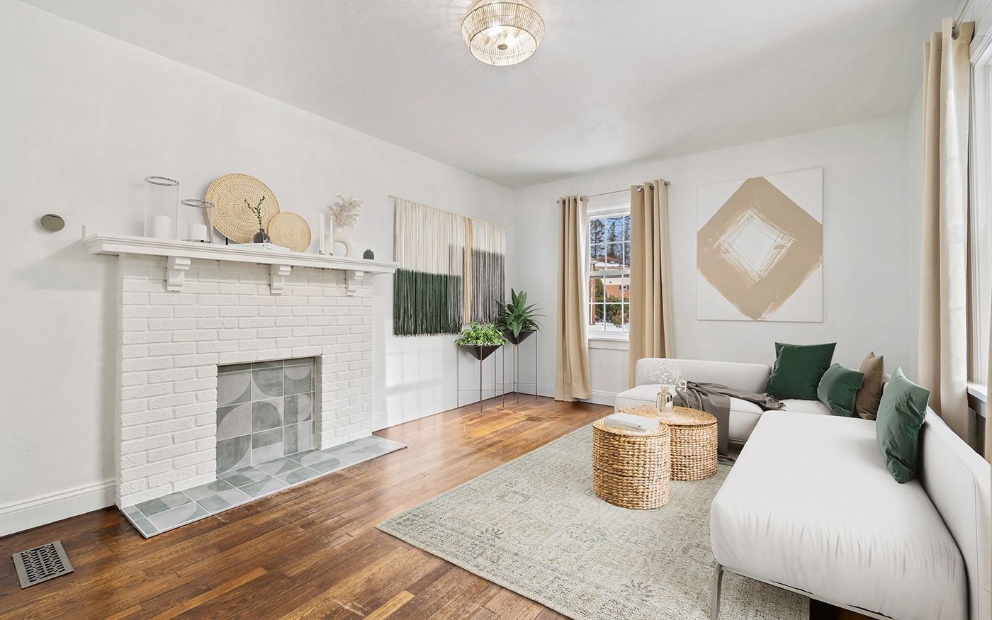 Living room with white walls, fireplace, white couch, and wooden accents.