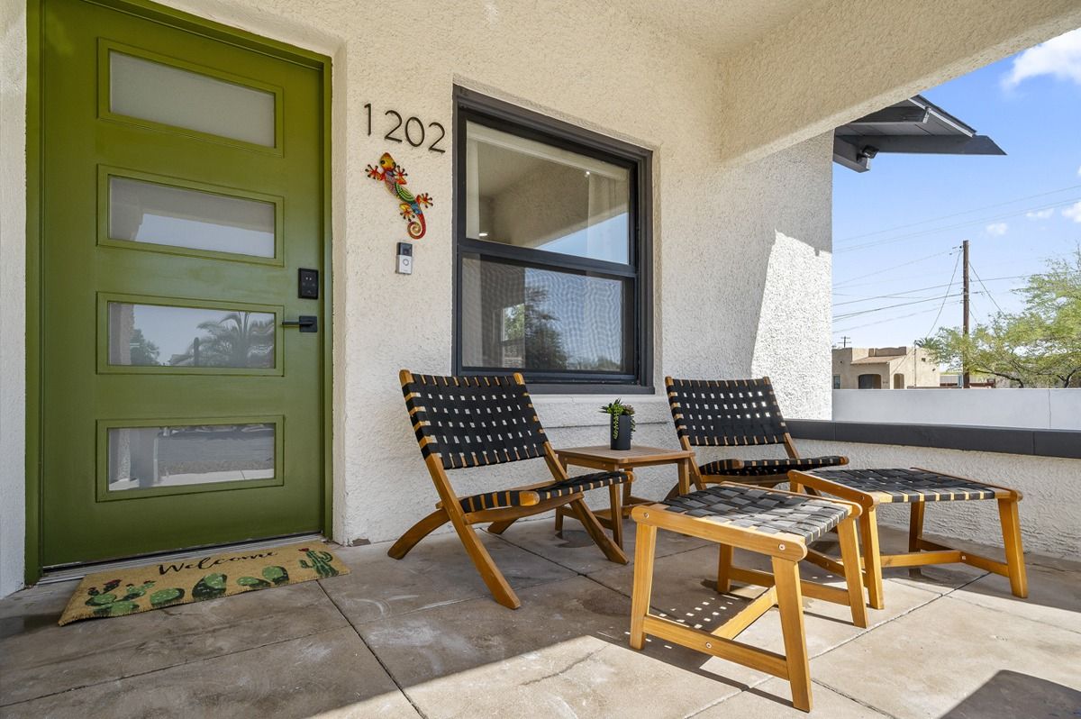 Green door with house number 