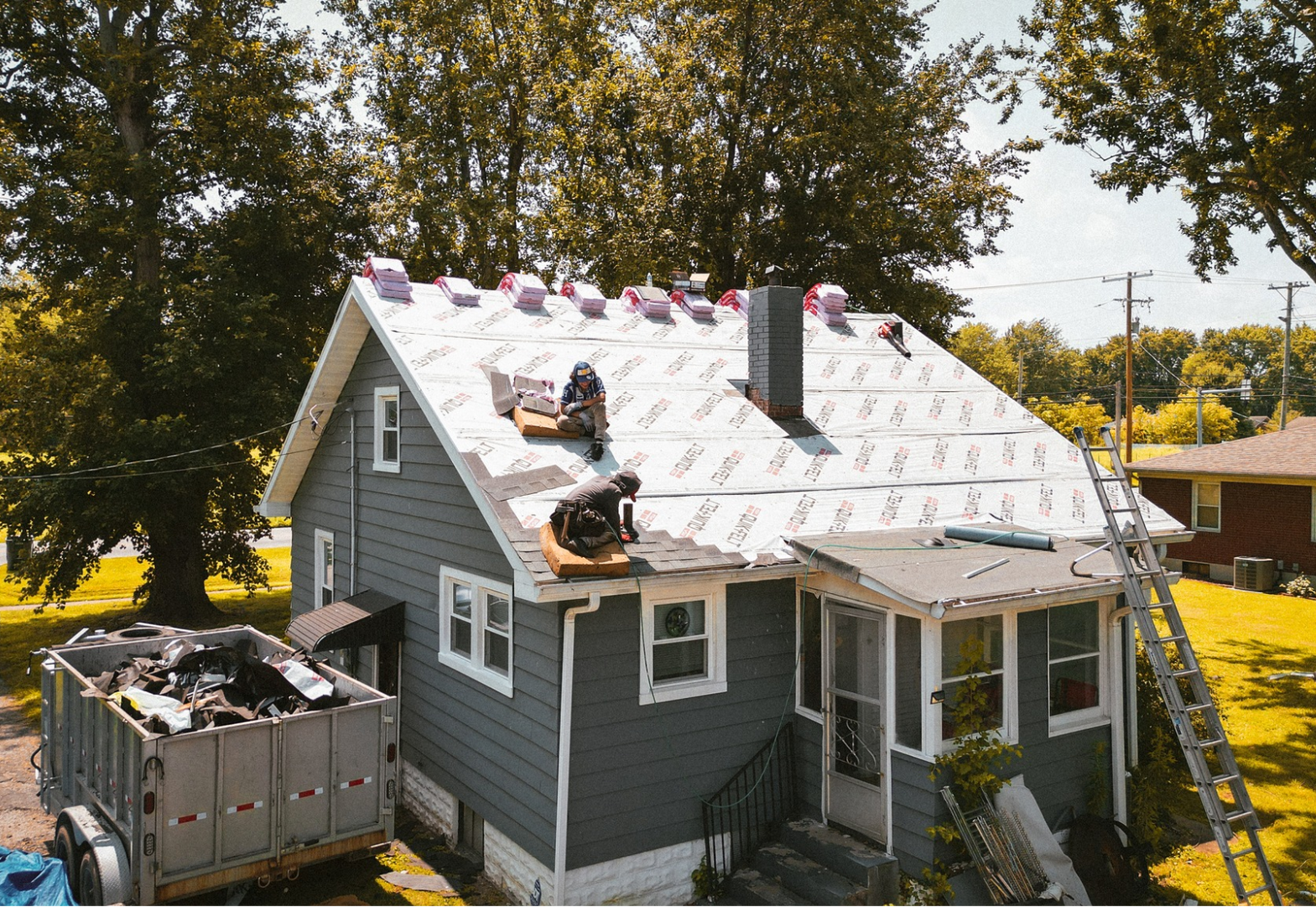 a house is being remodeled and the roof is being covered with a roofing material that says ' roof '