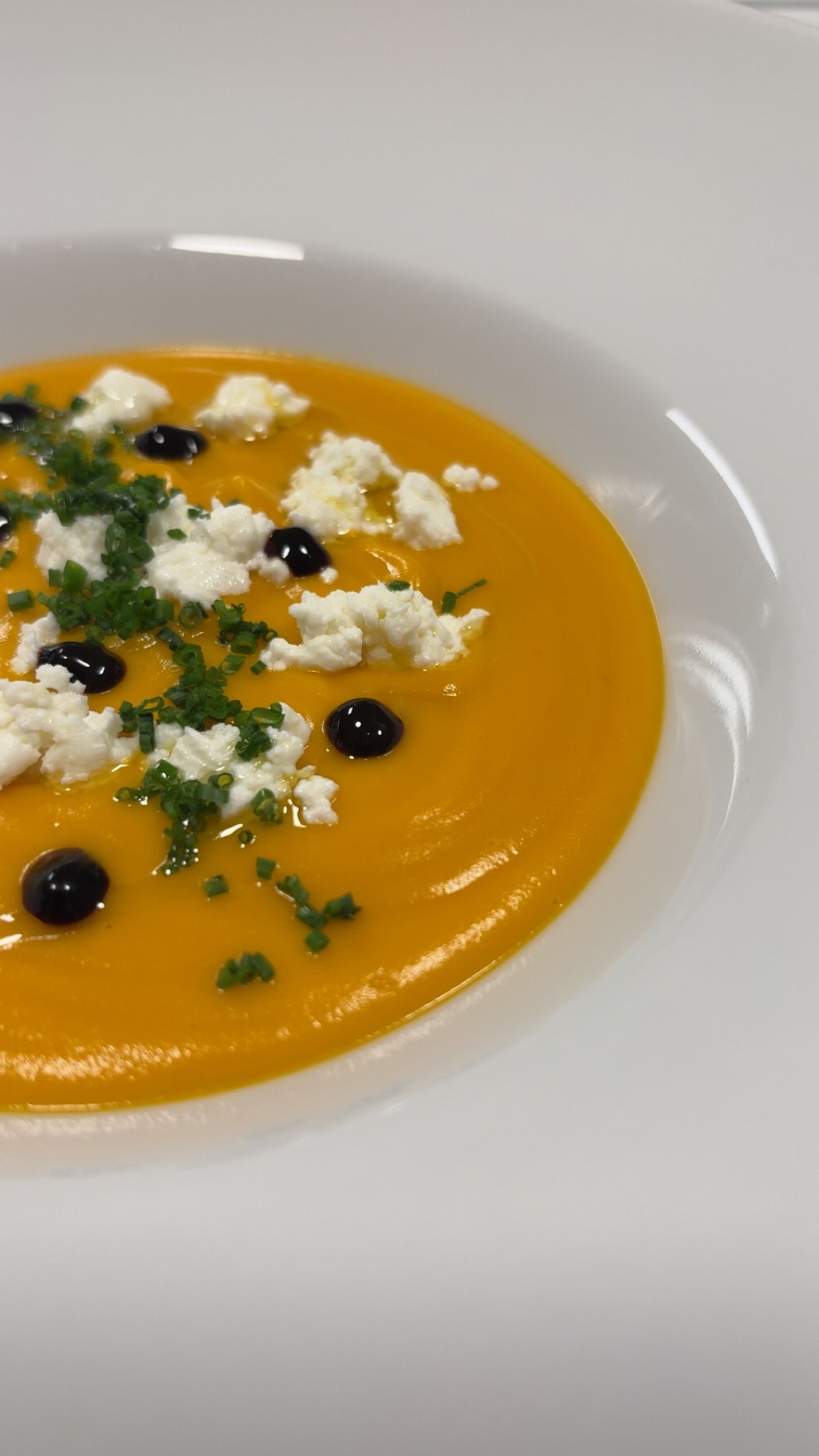 Butternut Squash & Heirloom Carrot soup topped with Goat Cheese & Saba