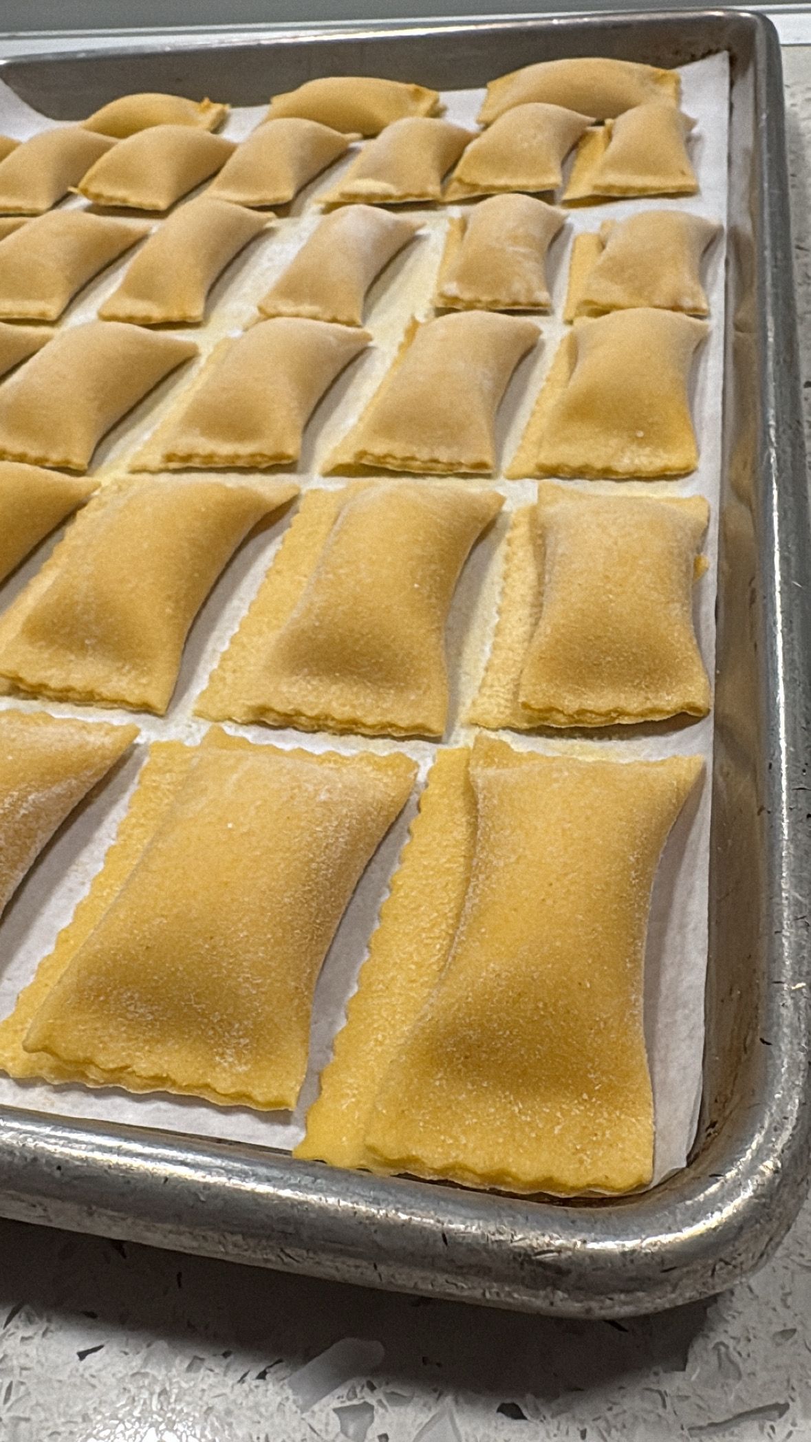 House made Honeynut Squash Agnolotti ready to be cooked