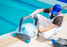 man set up the  pool cleaner