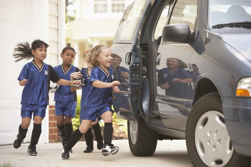 Children getting into a car