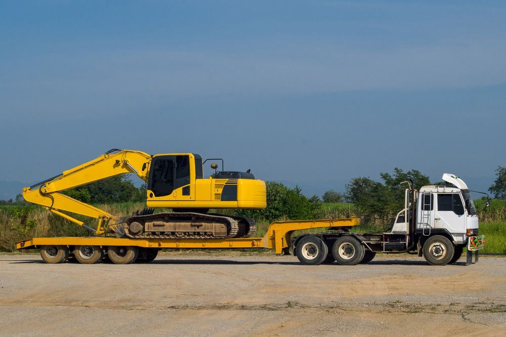 Excavator or Backhoe on a Truck — Earthworks in Corowa, NSW