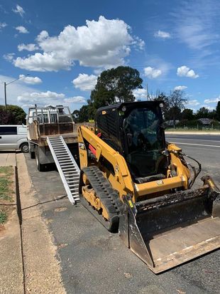Excavator Being Unloaded from a Truck — Earthworks in Corowa, NSW