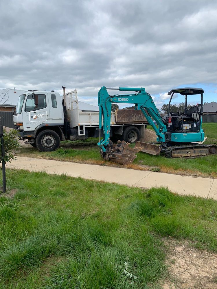 White Truck and Blue Excavator — Earthworks in Corowa, NSW