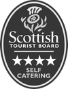 The logo for the scottish tourist board is black and white and says self catering.