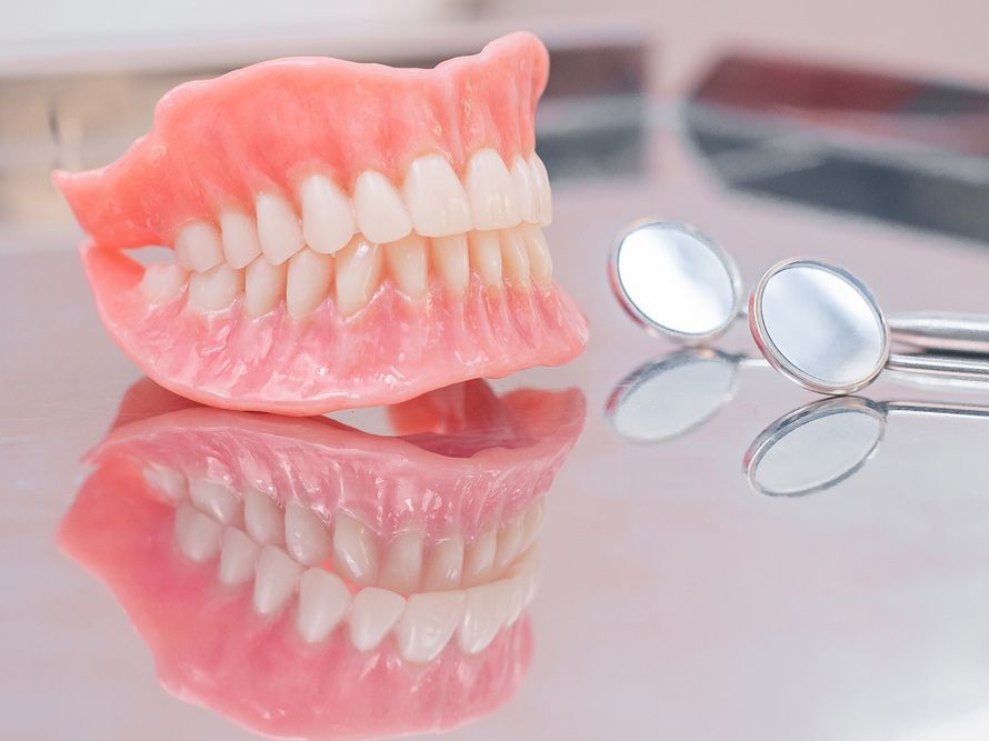 Instruments And Dental Hygienist Checkup Concept With Teeth Model Dentures And Mouth Mirror —  Smiles on Hobart In Hobart TAS