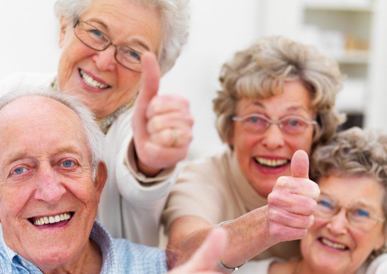 One Senior Man And Three Senior Woman Are Smiling And Thumbs Up —  Smiles on Hobart In Hobart TAS