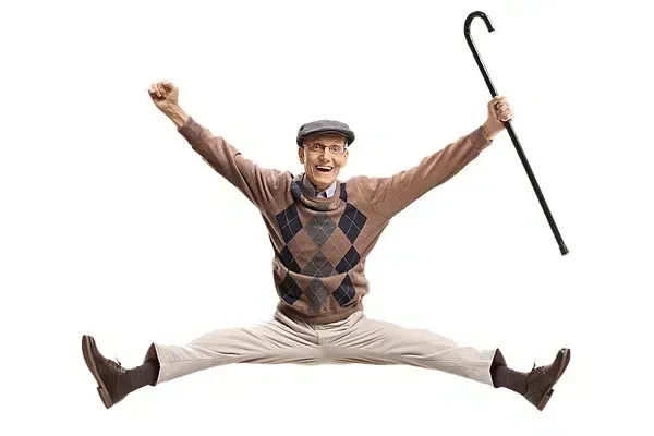 Senior Man Jumping With A Cane