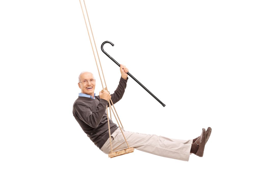 Senior Swinging On A Swing And Holding A Cane — Smiles on Hobart In Hobart TAS