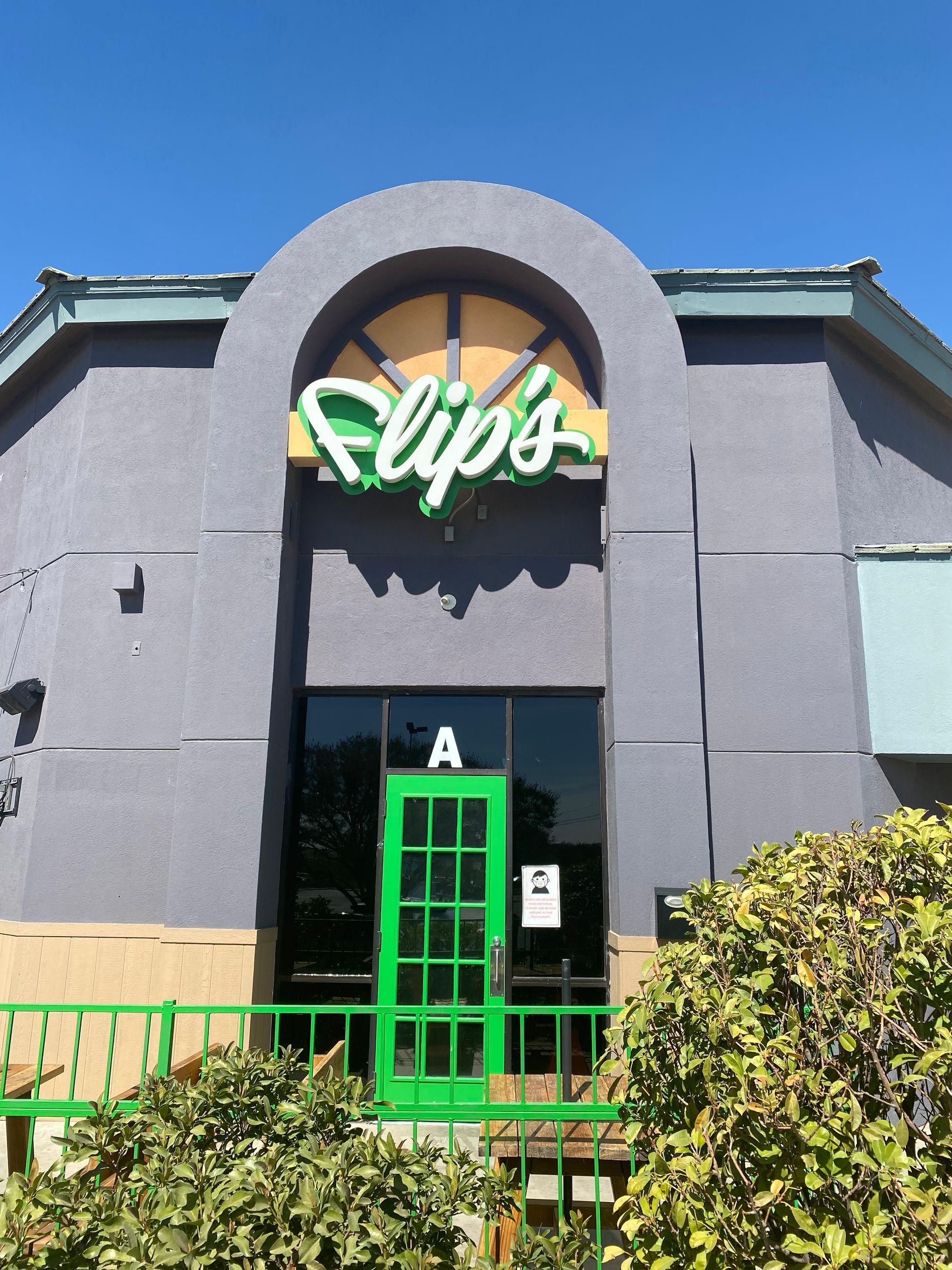 A restaurant called slip 's has a green door