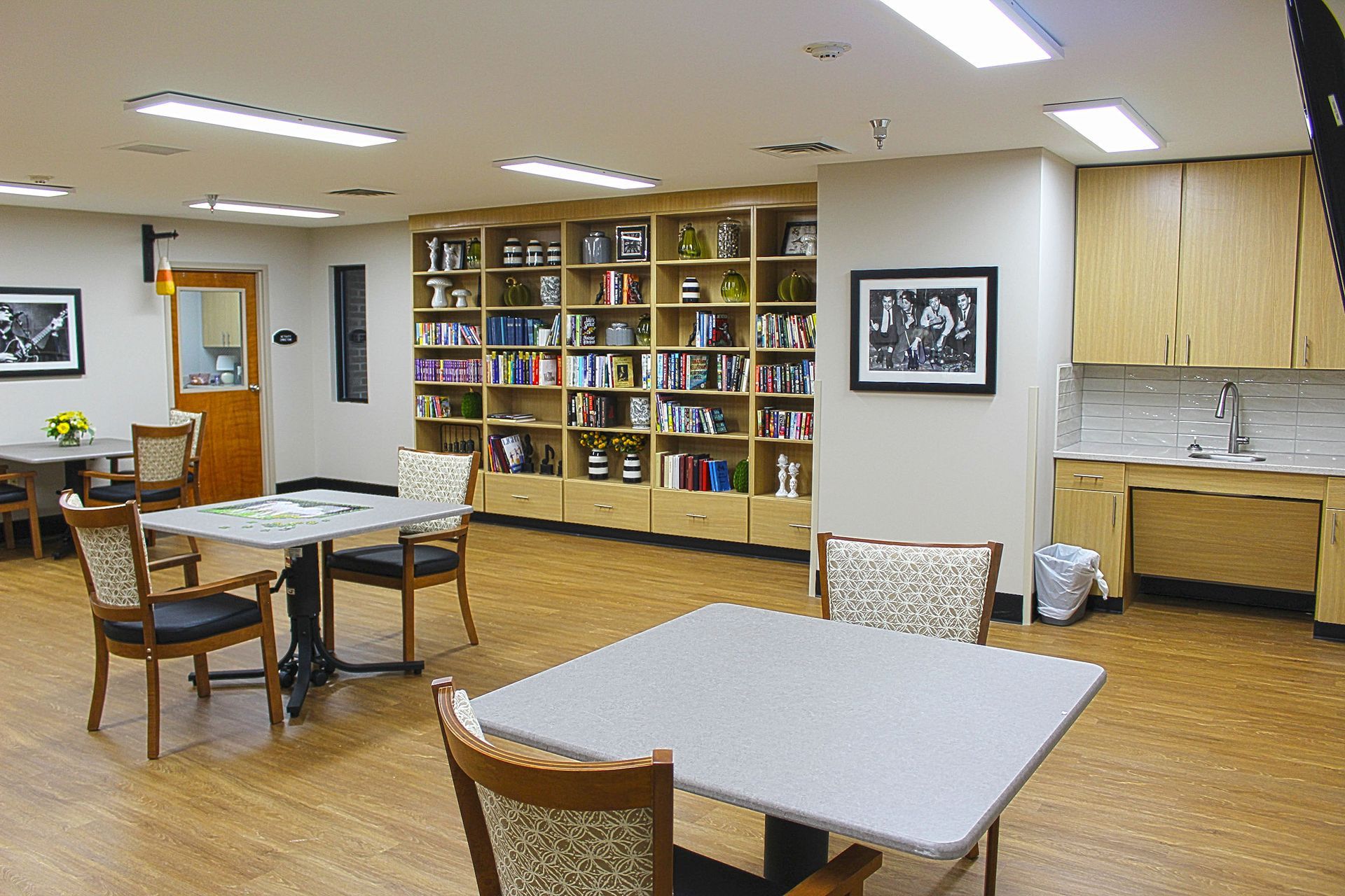 A large room with tables and chairs in it