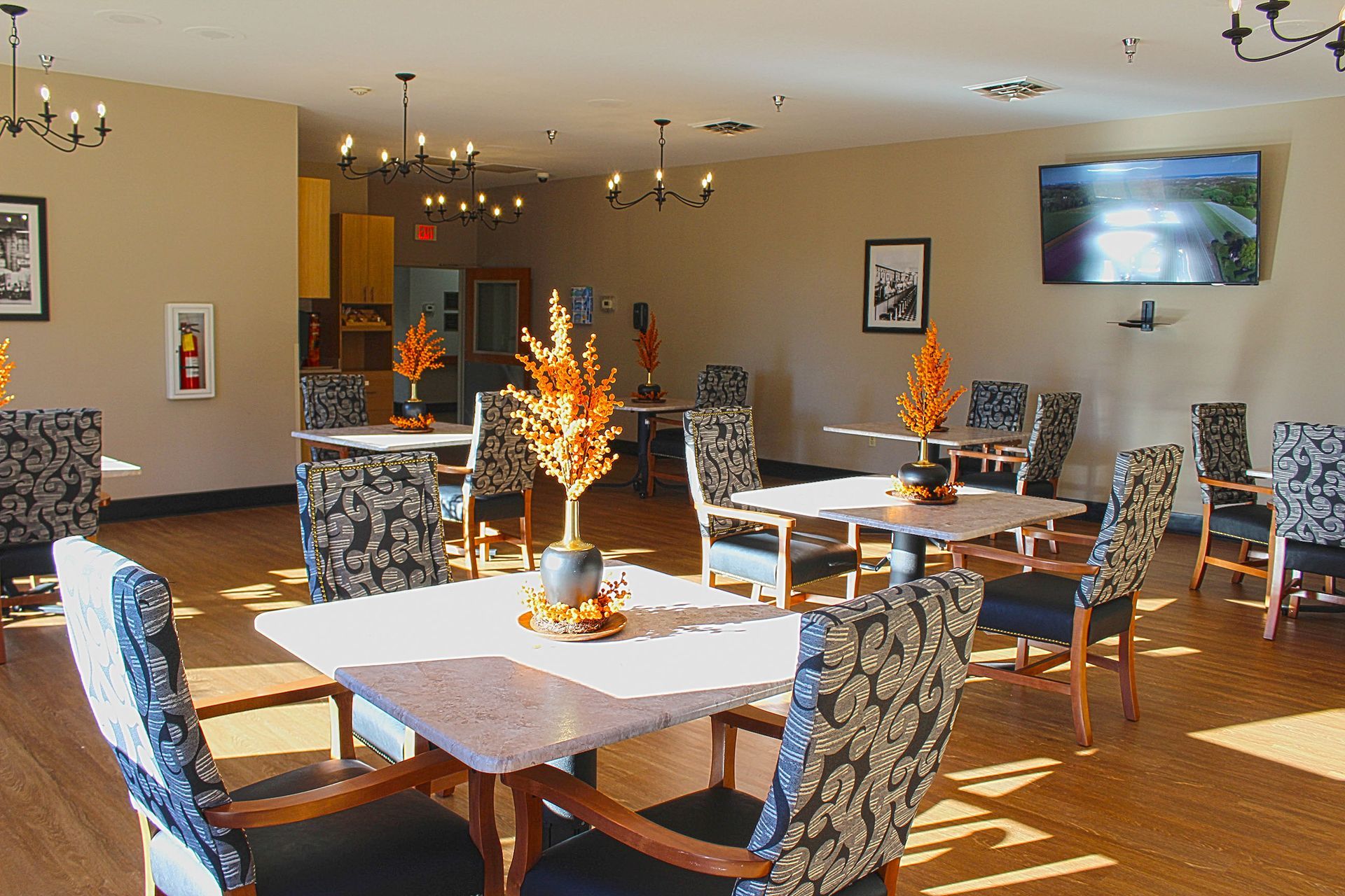 A large room with tables and chairs in it