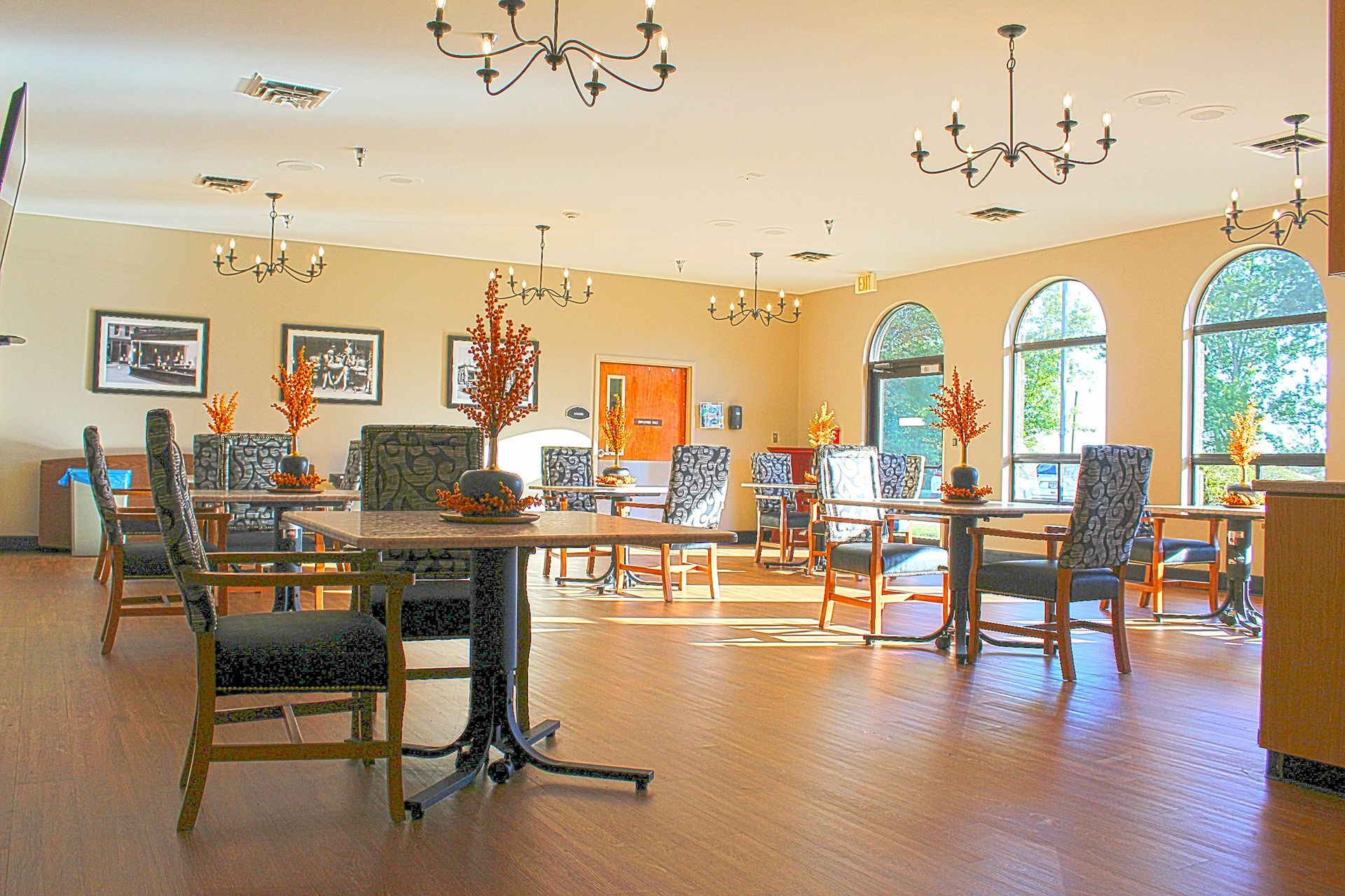A large room with tables and chairs in it