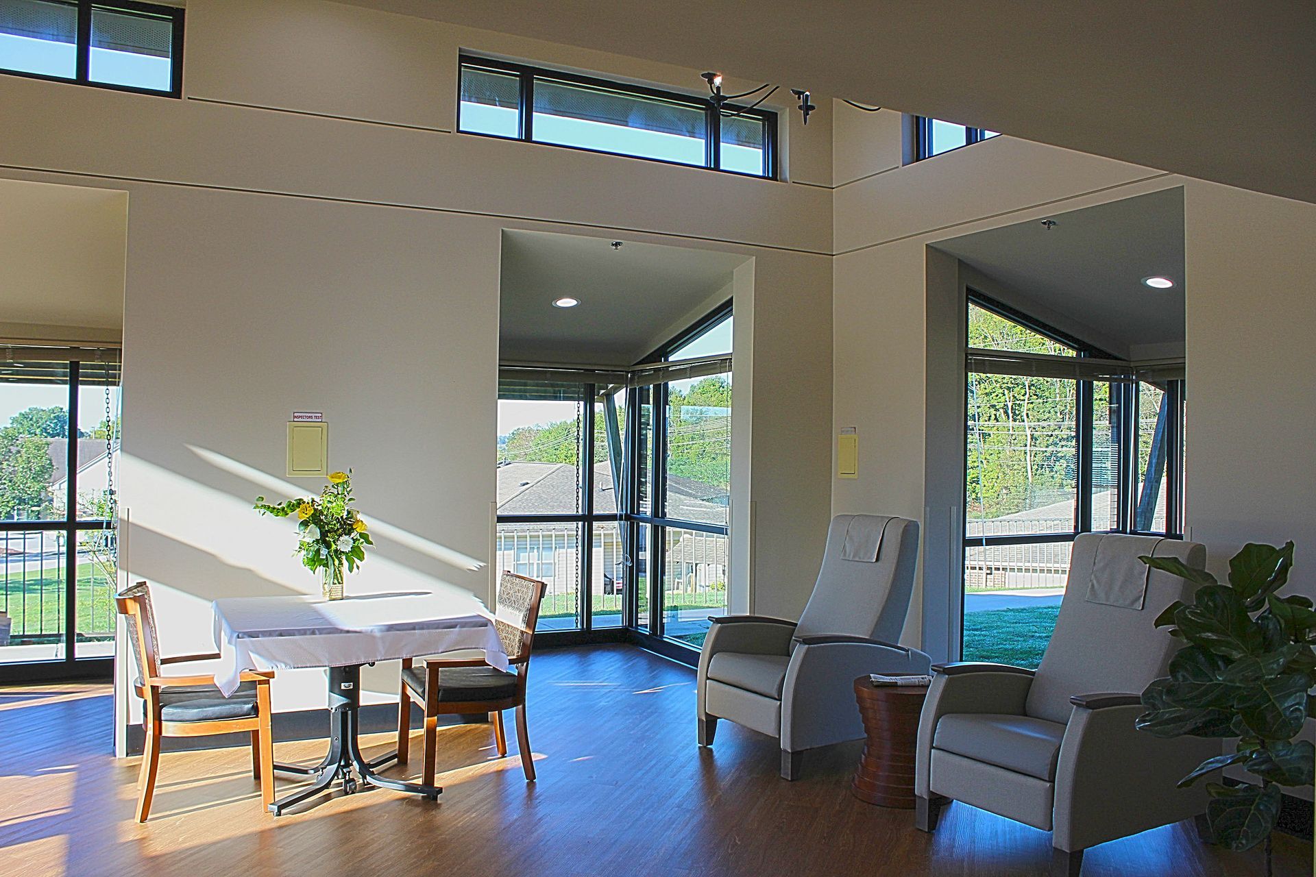 A large room with a table and chairs in it
