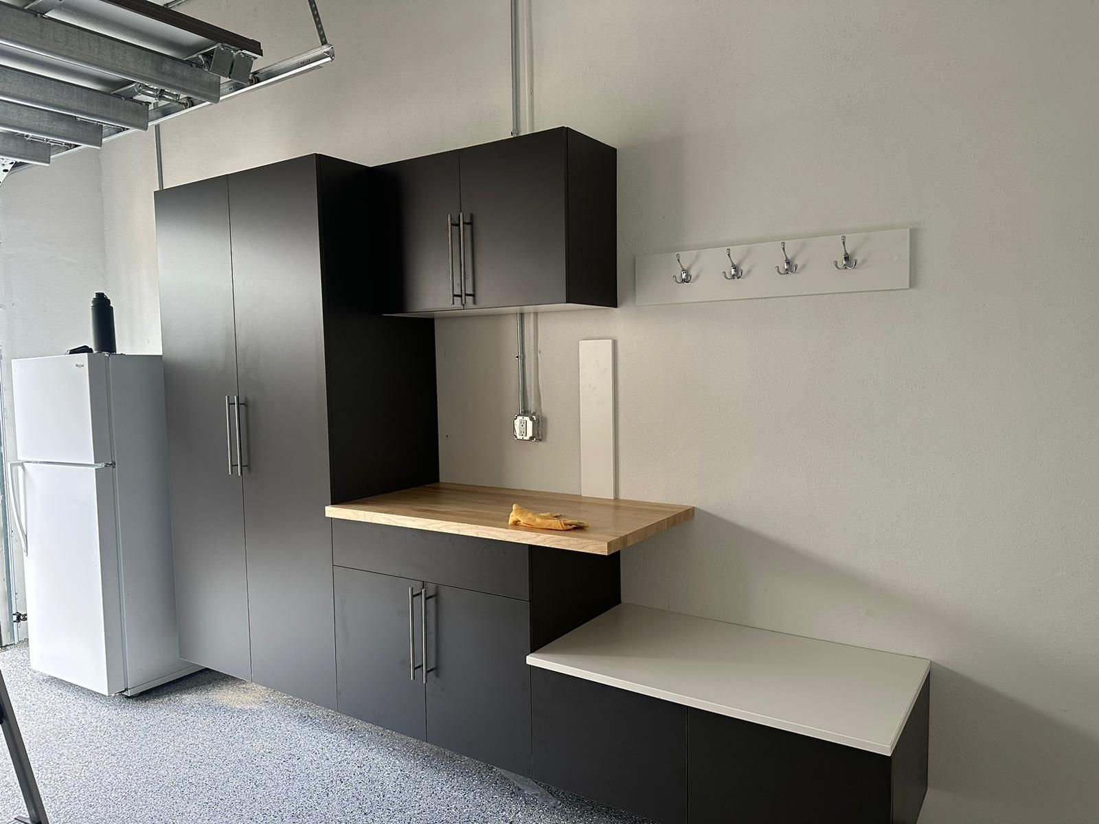 A garage with black cabinets