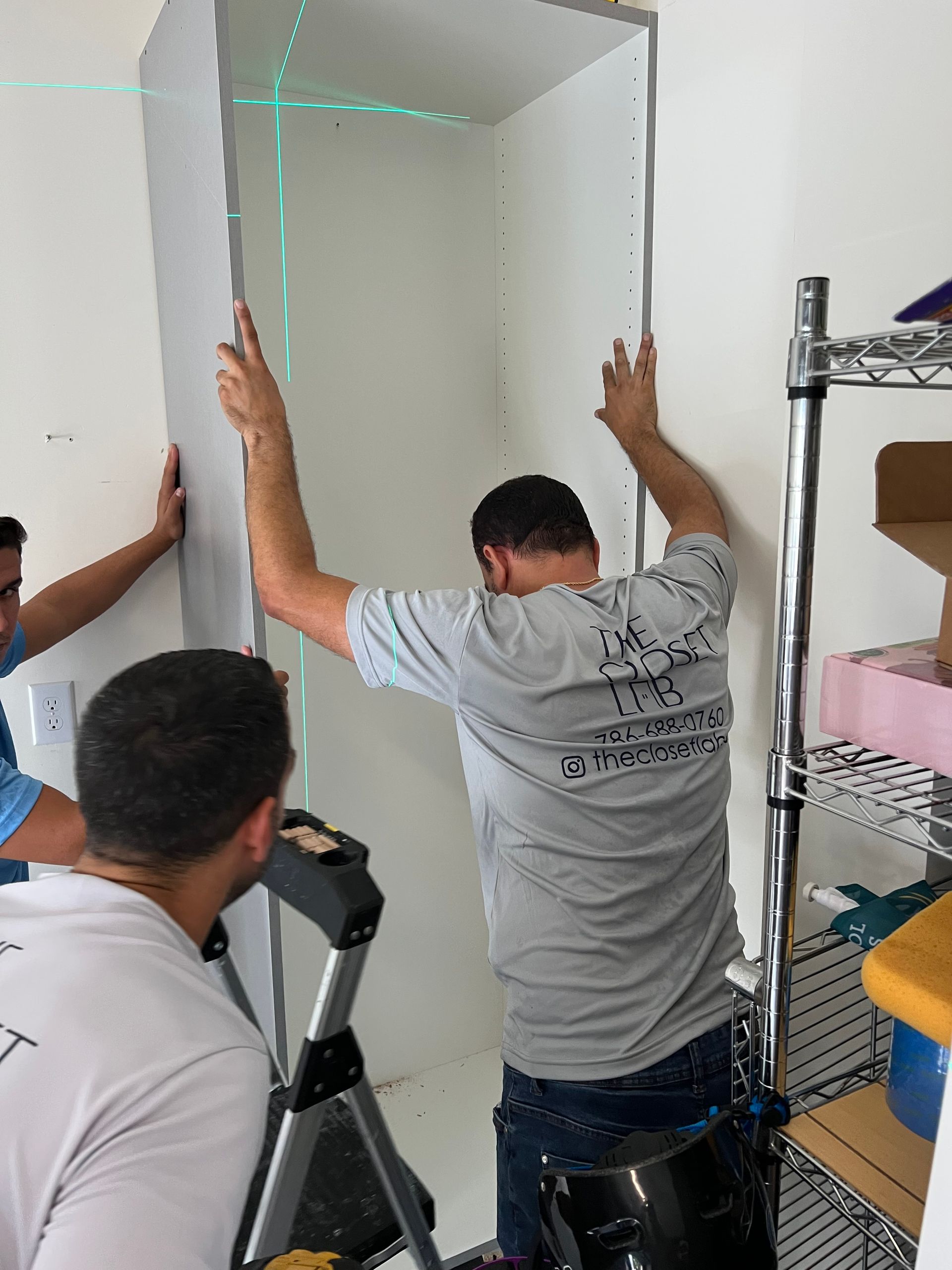 A man installing a tall garage 