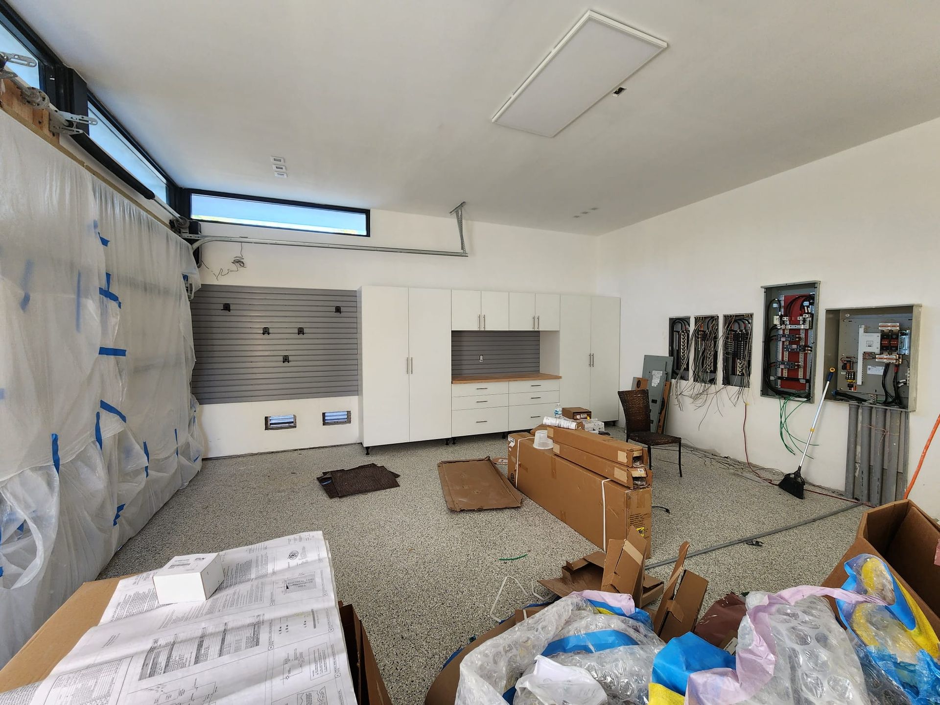 An empty garage organizer with a lot of boxes on the floor