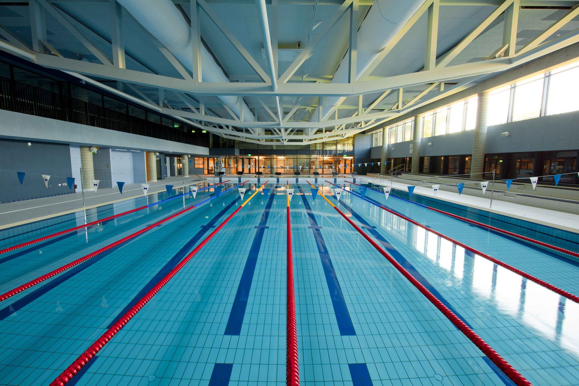 A group of people are sitting at a table working on a project.