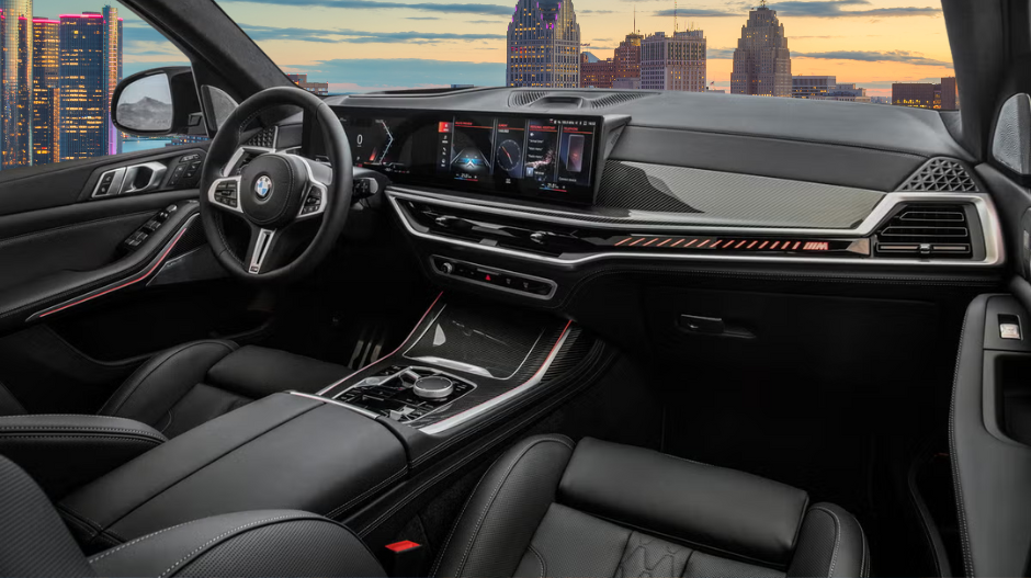 The interior of a car with black leather seats and a steering wheel