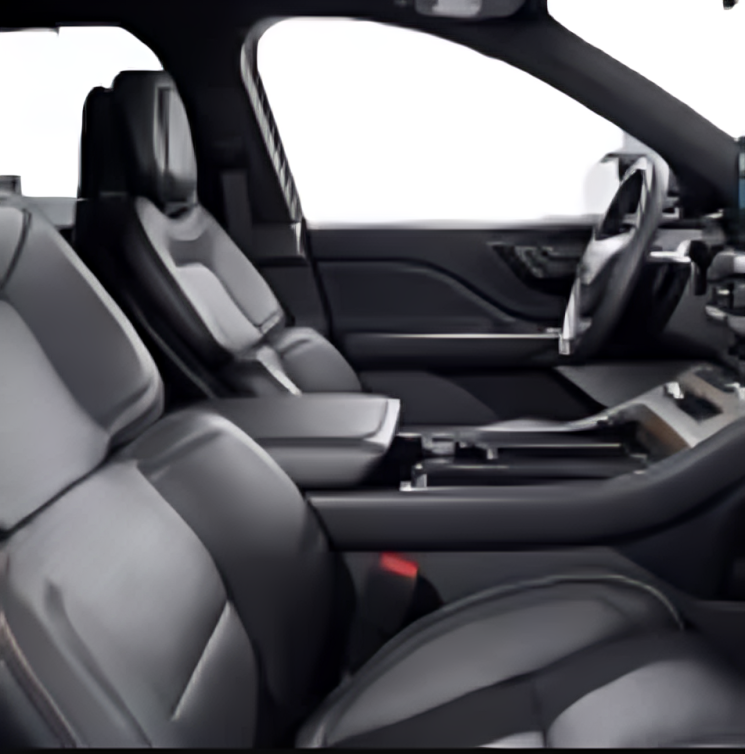 The interior of a car with black leather seats and a steering wheel