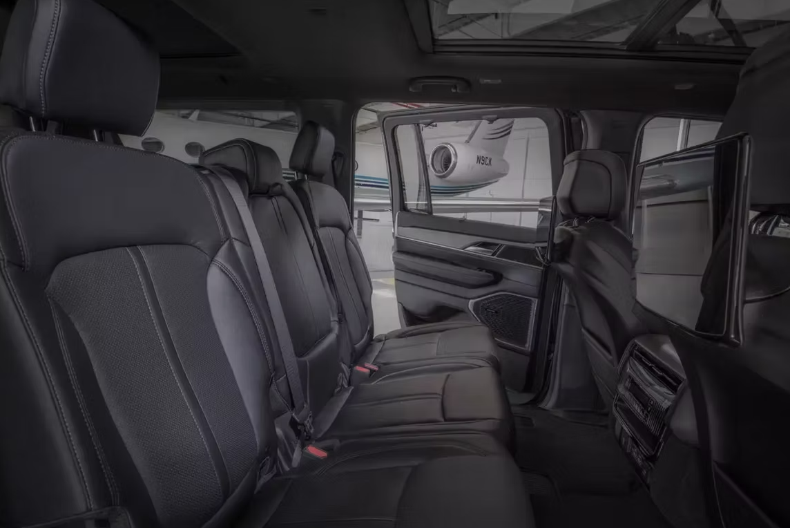 The rear seats of a jeep wrangler are very comfortable and have a sunroof.