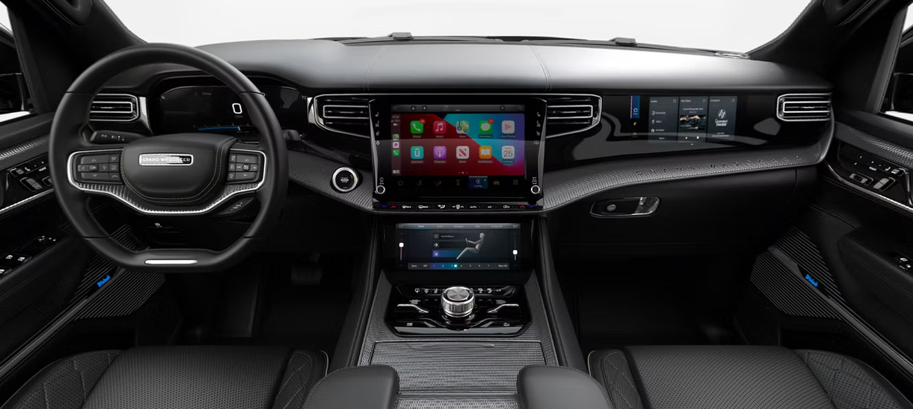 The interior of a jeep grand cherokee with a steering wheel and dashboard.